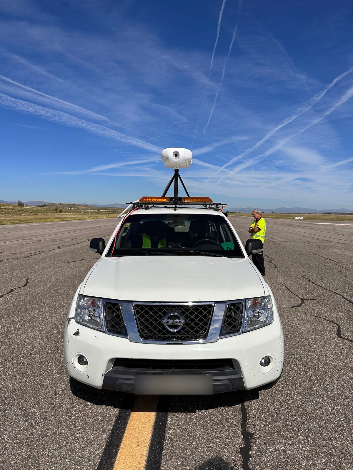 The detection unit mounted above the cab of an airside patrol vehicle.