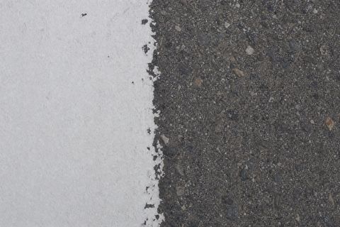 A painted runway marking edge on pavement.